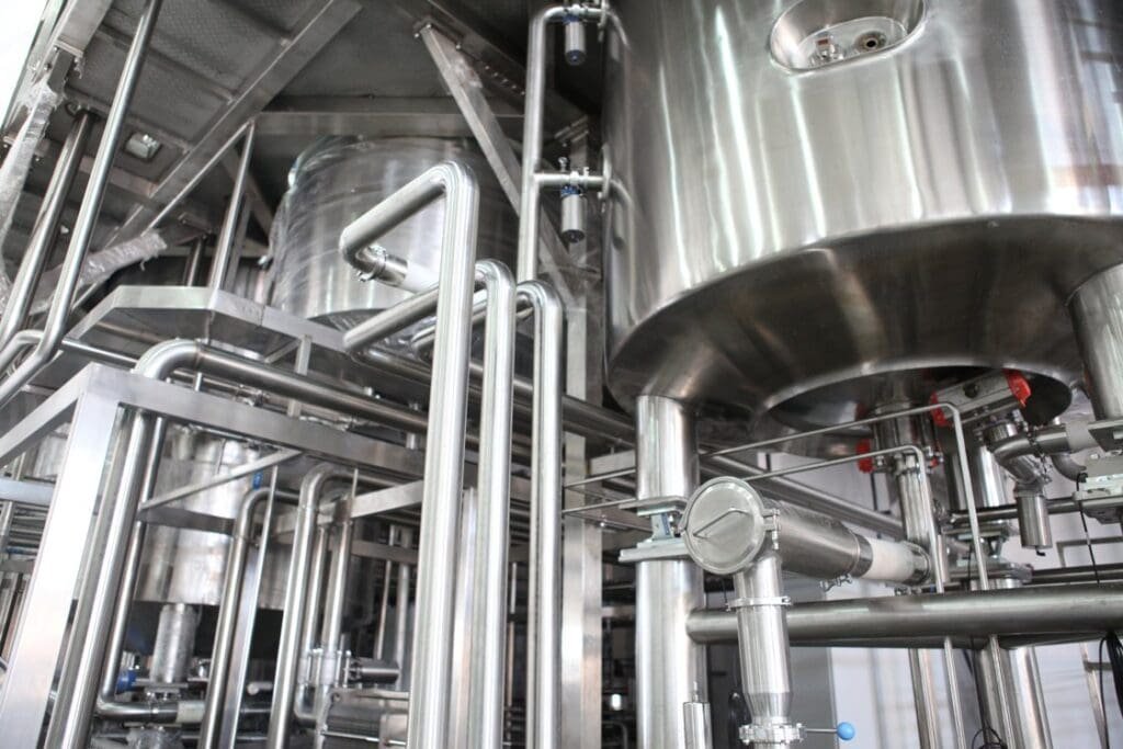 Industrial processing machinery showcases stainless steel tanks