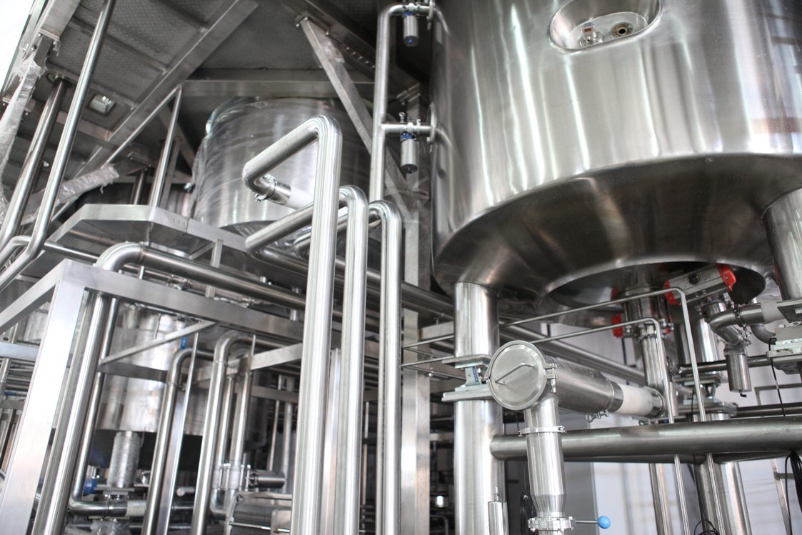 Industrial processing machinery showcases stainless steel tanks