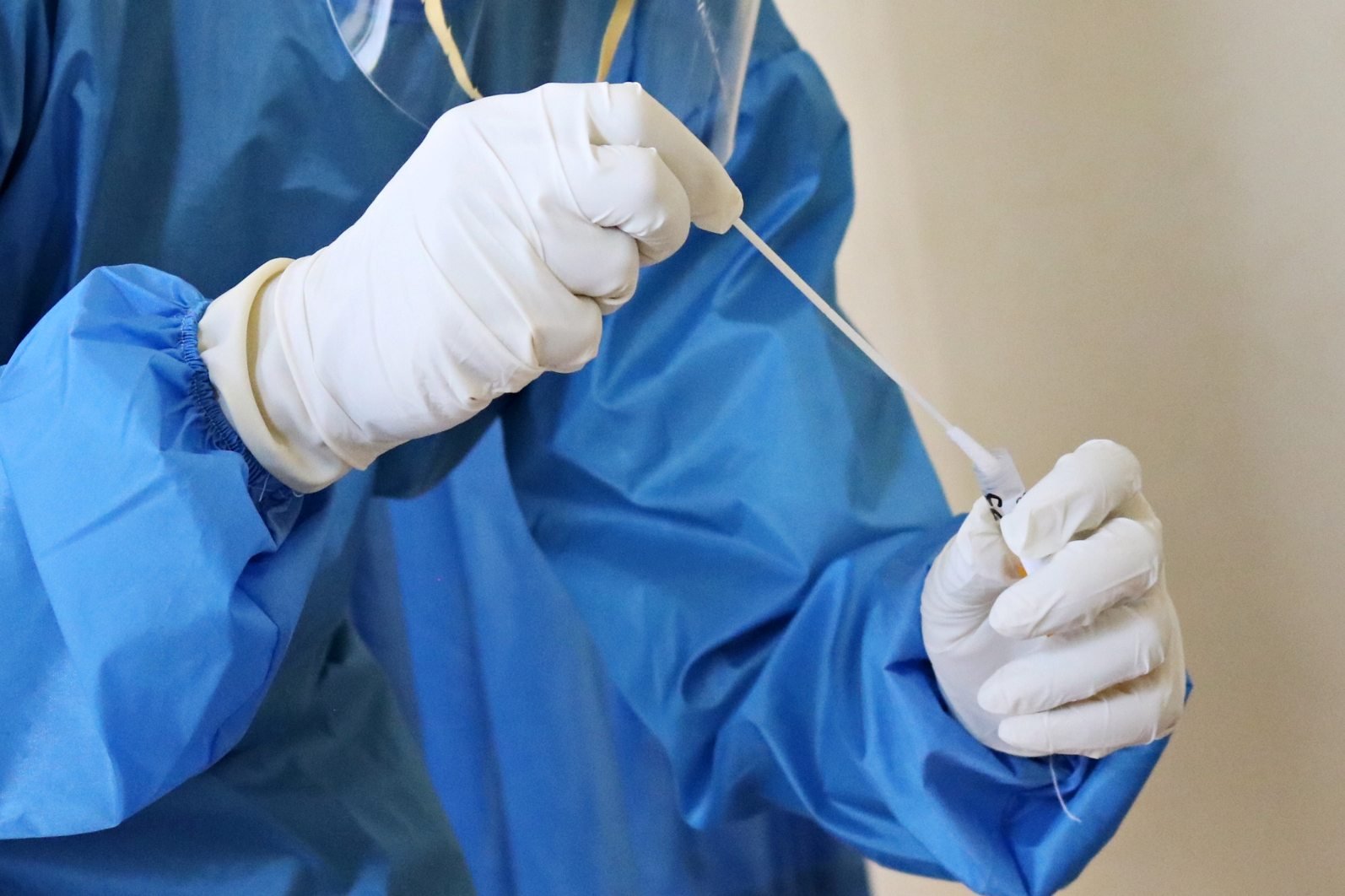 Is employer or employee liable for COVID testing costs under a new vaccine policy?